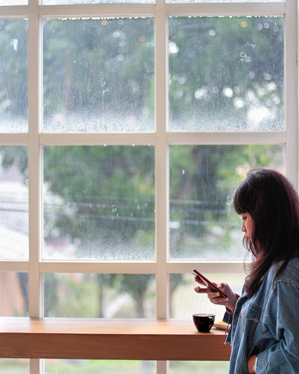 Young Professional looking at phone feeling stress about the future